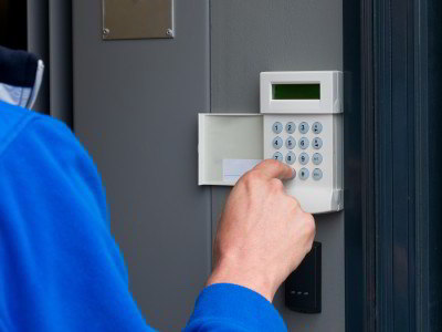person safely activating alarm system