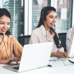 Business people wearing headset working actively in office . Call center, telemarketing, customer support agent provide service on telephone video conference call.
