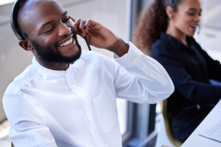 Man working at a U.S based answering service center